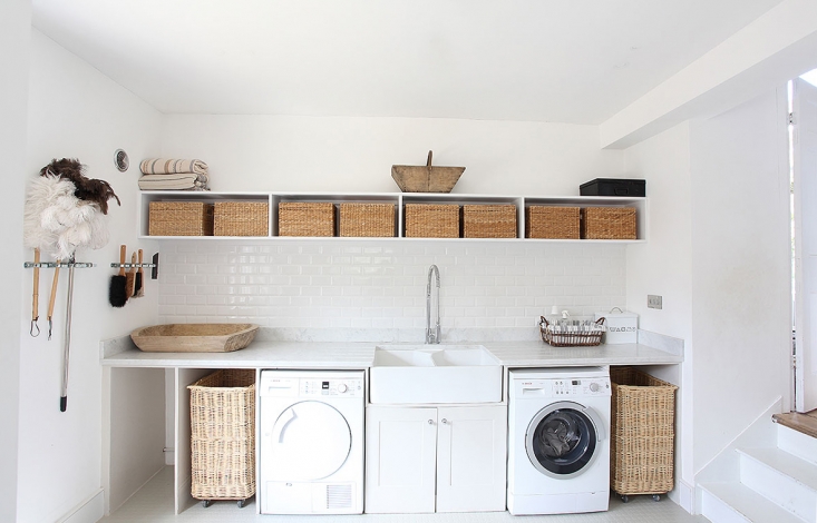 This airy laundry room has storage to spare. See Steal This Look: A Well-Equipped Laundry Room in Somerset to find similar products. Photograph courtesy of Light Locations.