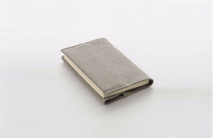 I used to wrap my textbooks, old-school style, in brown paper bags, rather than using the stretchy, multi-color fabric sleeves my classmates preferred. The Canvas Book Cover from Muji is a sophisticated adult take on the fabric cover; $8.